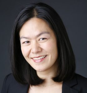 Photo of Evelyn Wang with dark background